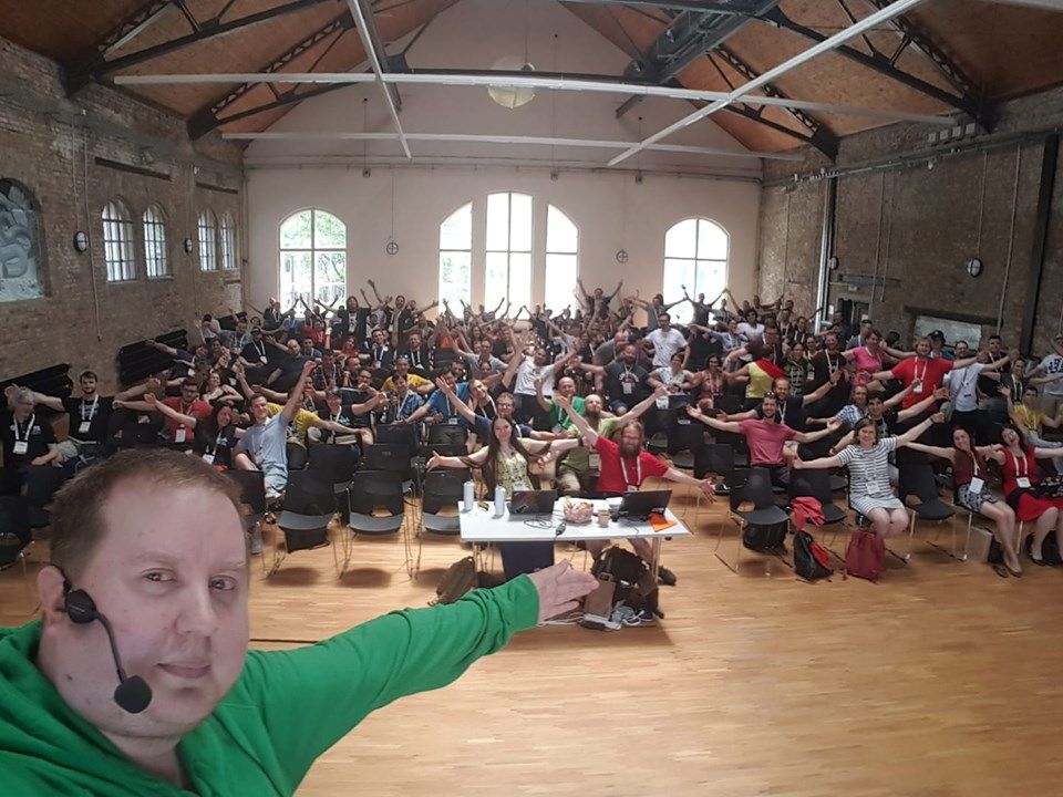 Me taking a selfie from PyCon CZ stage and everyone in audience spreading their arms to hug