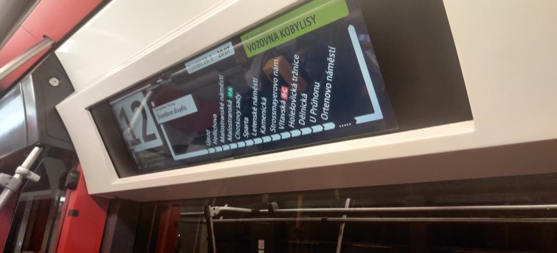 A stop display in a tram showing line 12 and a dozen or so next stops on the way 