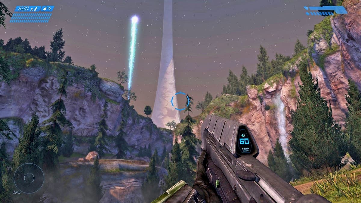 Master Chief pointing AR gun looking at the Halo