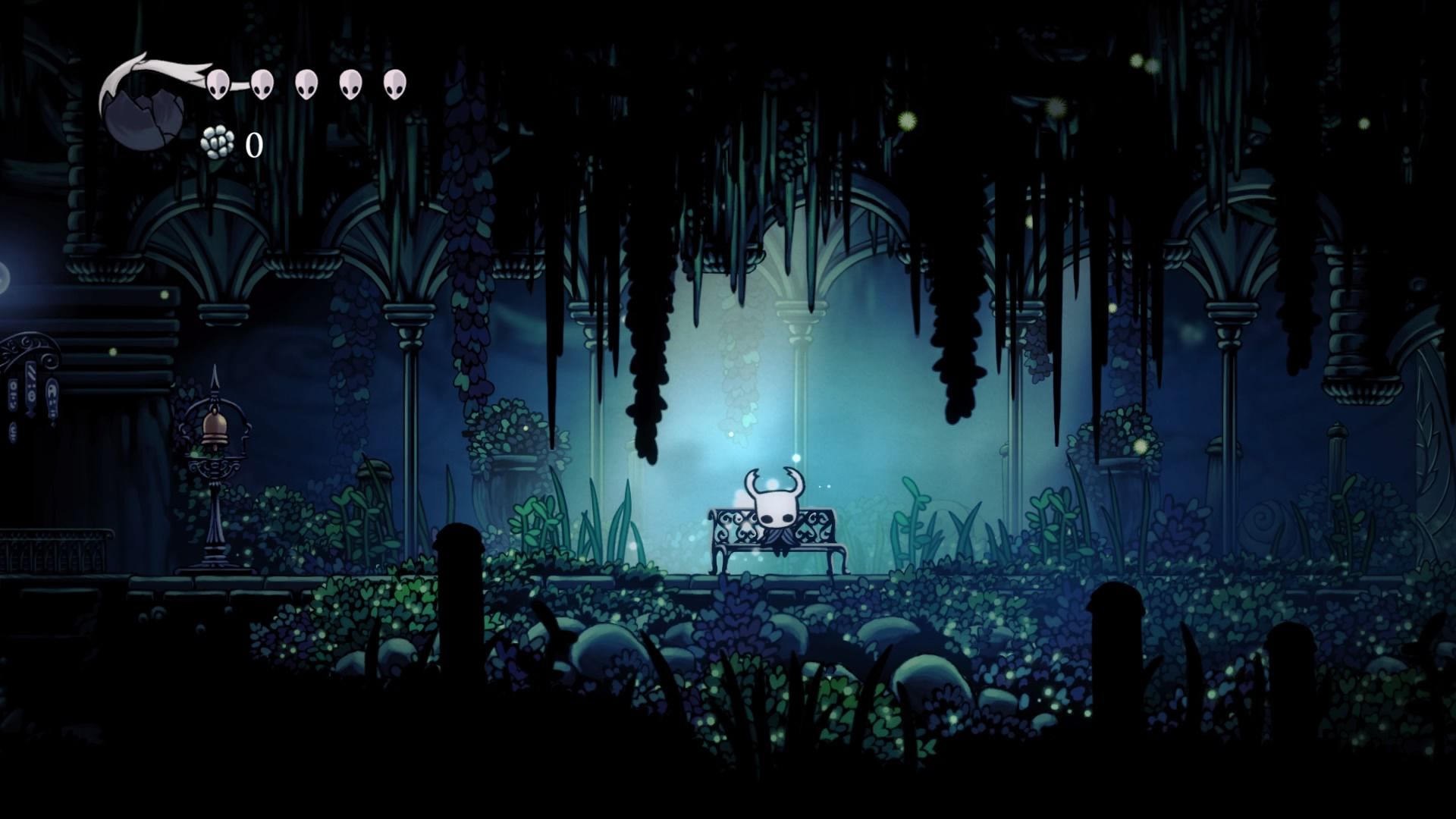 A bug from Hollow Knight sitting on a bench