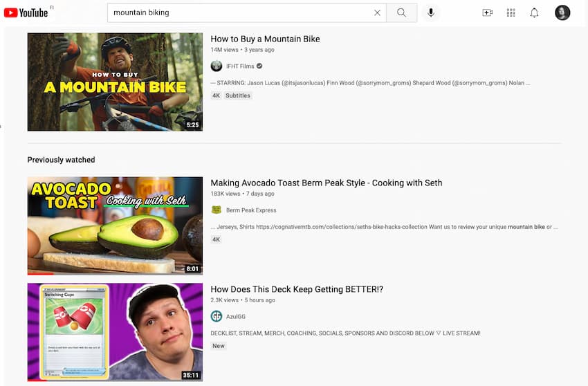 Youtube search for "mountain biking" showing "Previously watched" videos like Pokemon TCG