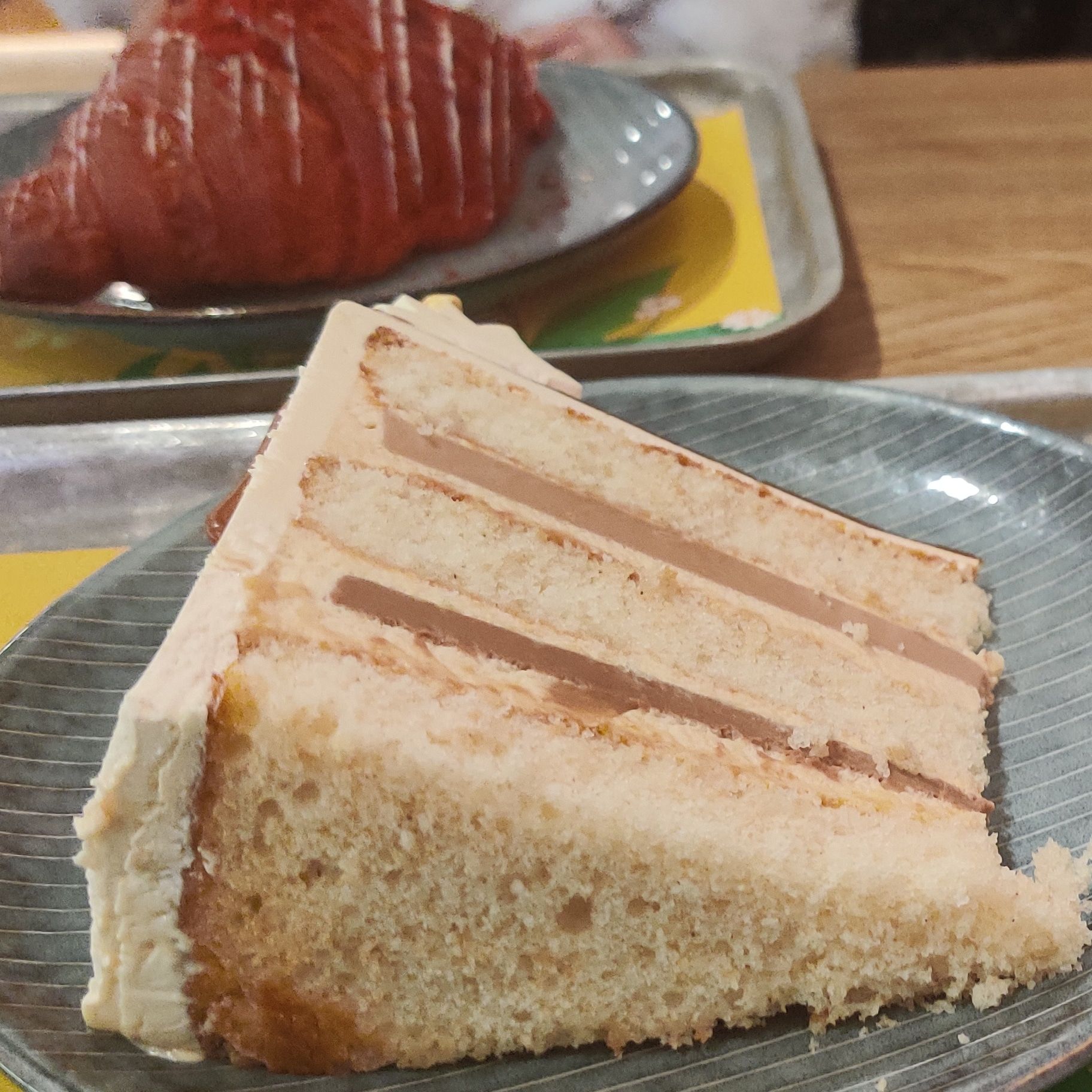 A huge slice of delicious caramel cake