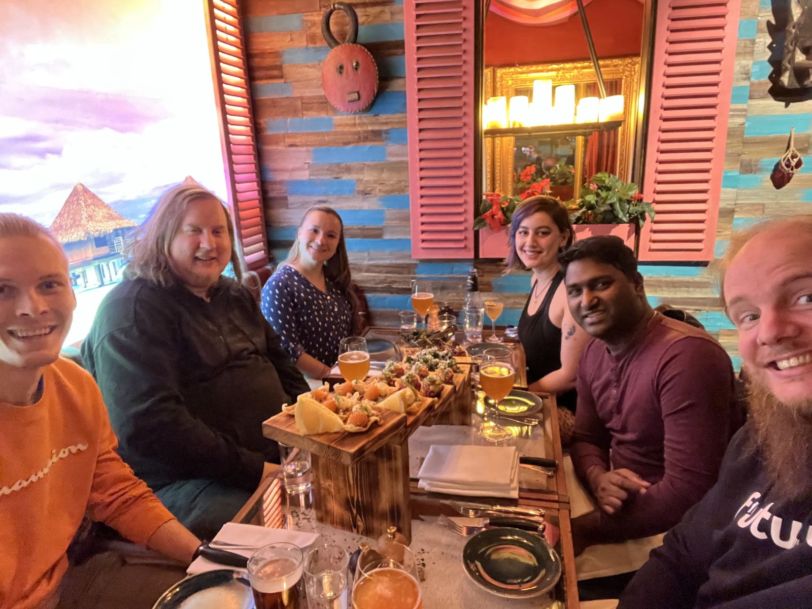 Six people eating fancy dinner in a restaurant