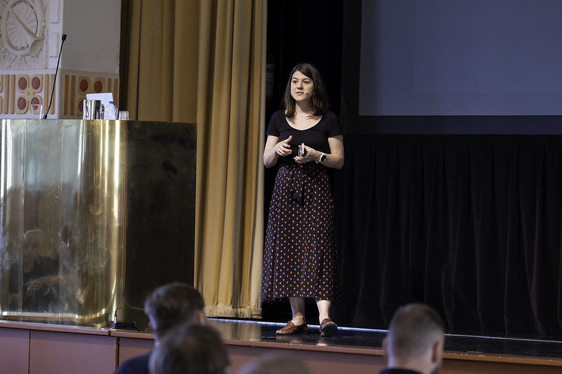 Maggie standing on a stage 