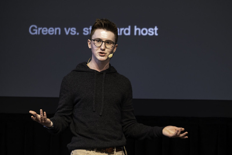 Ben speaking on a stage 